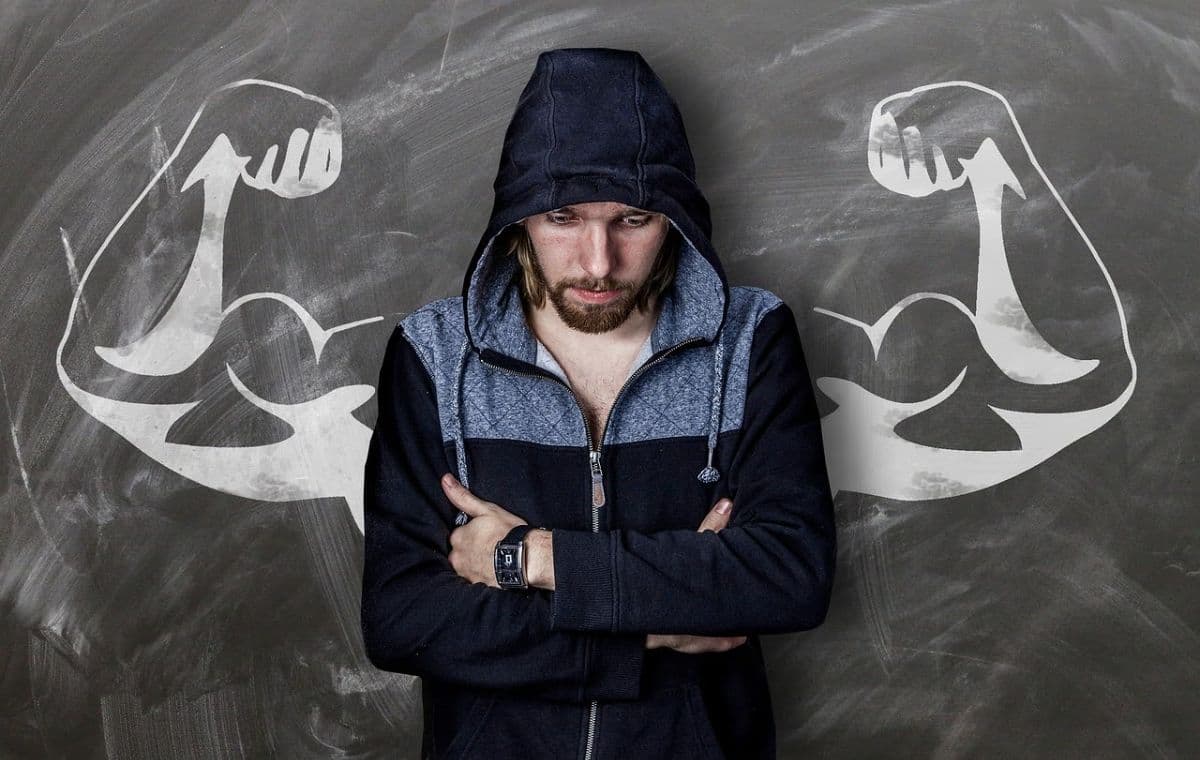 A man in a jacket near some strength images